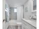 Clean bathroom with white vanity, bathtub shower combo, and mosaic tile at 4455 Duhme Rd # 305, St Petersburg, FL 33708