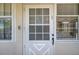 White front door with a gridded glass pattern and a door handle at 4455 Duhme Rd # 305, St Petersburg, FL 33708