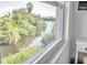 Stunning view of a waterway from a window, showcasing lush greenery at 4455 Duhme Rd # 305, St Petersburg, FL 33708