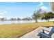 Peaceful backyard with lake view and patio seating at 4519 Lexington Cir # 4519, Bradenton, FL 34210