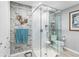 Modern bathroom with glass shower, wood-look walls, and marble flooring at 4519 Lexington Cir # 4519, Bradenton, FL 34210