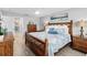 Spacious main bedroom with wood furniture and water view at 4519 Lexington Cir # 4519, Bradenton, FL 34210