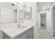 Updated bathroom with vanity and view of hallway at 4535 33Rd N Ave, St Petersburg, FL 33713