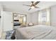 Bright bedroom with mirrored closet doors and a ceiling fan at 4535 33Rd N Ave, St Petersburg, FL 33713