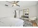 Well-lit bedroom featuring mirrored closet doors and ceiling fan at 4535 33Rd N Ave, St Petersburg, FL 33713