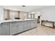 Open kitchen with island, gray cabinets, and white quartz countertops at 4535 33Rd N Ave, St Petersburg, FL 33713