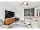 Living room with sectional sofa, TV stand, and built-in shelving at 4535 33Rd N Ave, St Petersburg, FL 33713