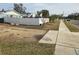 Vacant lot with a white fence and sidewalk at 4701 Lodestone Dr, Tampa, FL 33615