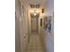 Long hallway with tile floors and built-in closets at 4701 Lodestone Dr, Tampa, FL 33615