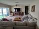 Living area showcasing sectional sofa and large TV at 4701 Lodestone Dr, Tampa, FL 33615