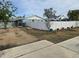 Spacious side yard with gravel and a white fence at 4701 Lodestone Dr, Tampa, FL 33615