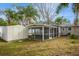 Spacious backyard with shed, screened porch, and mature trees at 5053 3Rd N Ave, St Petersburg, FL 33710