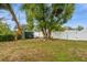 Fenced backyard with storage shed and large shade tree at 5053 3Rd N Ave, St Petersburg, FL 33710