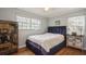 Spacious bedroom with hardwood floors and a ceiling fan at 5053 3Rd N Ave, St Petersburg, FL 33710