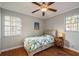 Bright bedroom with hardwood floors, ceiling fan, and window at 5053 3Rd N Ave, St Petersburg, FL 33710