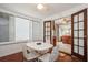 Bright dining area with white table and chairs near kitchen at 5053 3Rd N Ave, St Petersburg, FL 33710