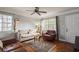 Bright living room with hardwood floors and a ceiling fan at 5053 3Rd N Ave, St Petersburg, FL 33710