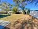 Large backyard with grassy area and storage shed at 5205 Landsman Ave, Tampa, FL 33625