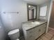 Updated bathroom with vanity and toilet at 5205 Landsman Ave, Tampa, FL 33625