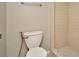 Bathroom featuring a toilet and tiled walk-in shower with updated fixtures at 5205 Landsman Ave, Tampa, FL 33625