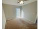 Carpeted bedroom with a window and ceiling fan at 5205 Landsman Ave, Tampa, FL 33625