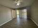 Spacious bedroom with wood-look flooring and sliding glass doors at 5205 Landsman Ave, Tampa, FL 33625