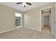 Bedroom featuring carpet flooring, neutral walls, and a window for natural light at 5205 Landsman Ave, Tampa, FL 33625