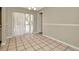 Neutral dining area with tiled floor, seamlessly connecting to other rooms, and offering easy access to the outdoors at 5205 Landsman Ave, Tampa, FL 33625