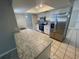 Modern kitchen with stainless steel appliances and granite countertops at 5205 Landsman Ave, Tampa, FL 33625