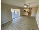 Living room with vinyl flooring and sliding doors leading to a patio at 5205 Landsman Ave, Tampa, FL 33625