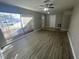 Bright living room featuring wood-look flooring and large windows at 5205 Landsman Ave, Tampa, FL 33625