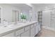 Double vanity bathroom with a walk-in shower at 5246 Salt Marsh Rd, Wimauma, FL 33598