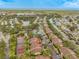 Aerial view showing condo community, tennis courts, and waterfront at 5557 Baywater Dr, Tampa, FL 33615