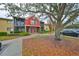 Two-story condo building with red exterior at 5557 Baywater Dr, Tampa, FL 33615