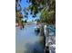 Peaceful waterfront view with sailboat and kayak at 5557 Baywater Dr, Tampa, FL 33615