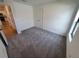 Simple bedroom with neutral carpet and closet at 5710 Humkey St, North Port, FL 34291