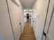 Hallway view of kitchen and other rooms. Tile floors throughout at 5710 Humkey St, North Port, FL 34291