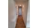 Clean hallway with tile floors and access to bedrooms and other rooms at 5710 Humkey St, North Port, FL 34291