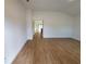 Bright and spacious living area with wood-look flooring at 5710 Humkey St, North Port, FL 34291