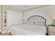 King bed, white walls, and built-in closet at 629 Alhambra Rd # 604, Venice, FL 34285