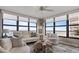 Bright living room with ocean views, comfy seating, and stylish decor at 629 Alhambra Rd # 604, Venice, FL 34285