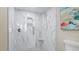 Large walk-in shower with marble tile at 629 Alhambra Rd # 604, Venice, FL 34285