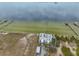 Aerial view of waterfront property with a building and parking at 6504 Surfside Blvd # 5, Apollo Beach, FL 33572