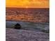 Brick patio overlooks the water with a beautiful sunset at 6504 Surfside Blvd # 5, Apollo Beach, FL 33572