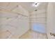 Large closet with wire shelving for ample storage at 6623 Aspen Ct, Zephyrhills, FL 33542