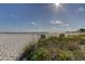 Beachfront view with volleyball net and ocean at 680 71St Ave # 14, St Pete Beach, FL 33706