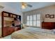 Bedroom with double bed, chair, and built-in shelving at 680 71St Ave # 14, St Pete Beach, FL 33706