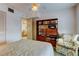 Bedroom with double bed, chair, and built-in shelving at 680 71St Ave # 14, St Pete Beach, FL 33706