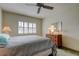 Bright bedroom with double bed, dresser, and ceiling fan at 680 71St Ave # 14, St Pete Beach, FL 33706