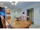 Dining area with wood table and chairs near kitchen at 680 71St Ave # 14, St Pete Beach, FL 33706